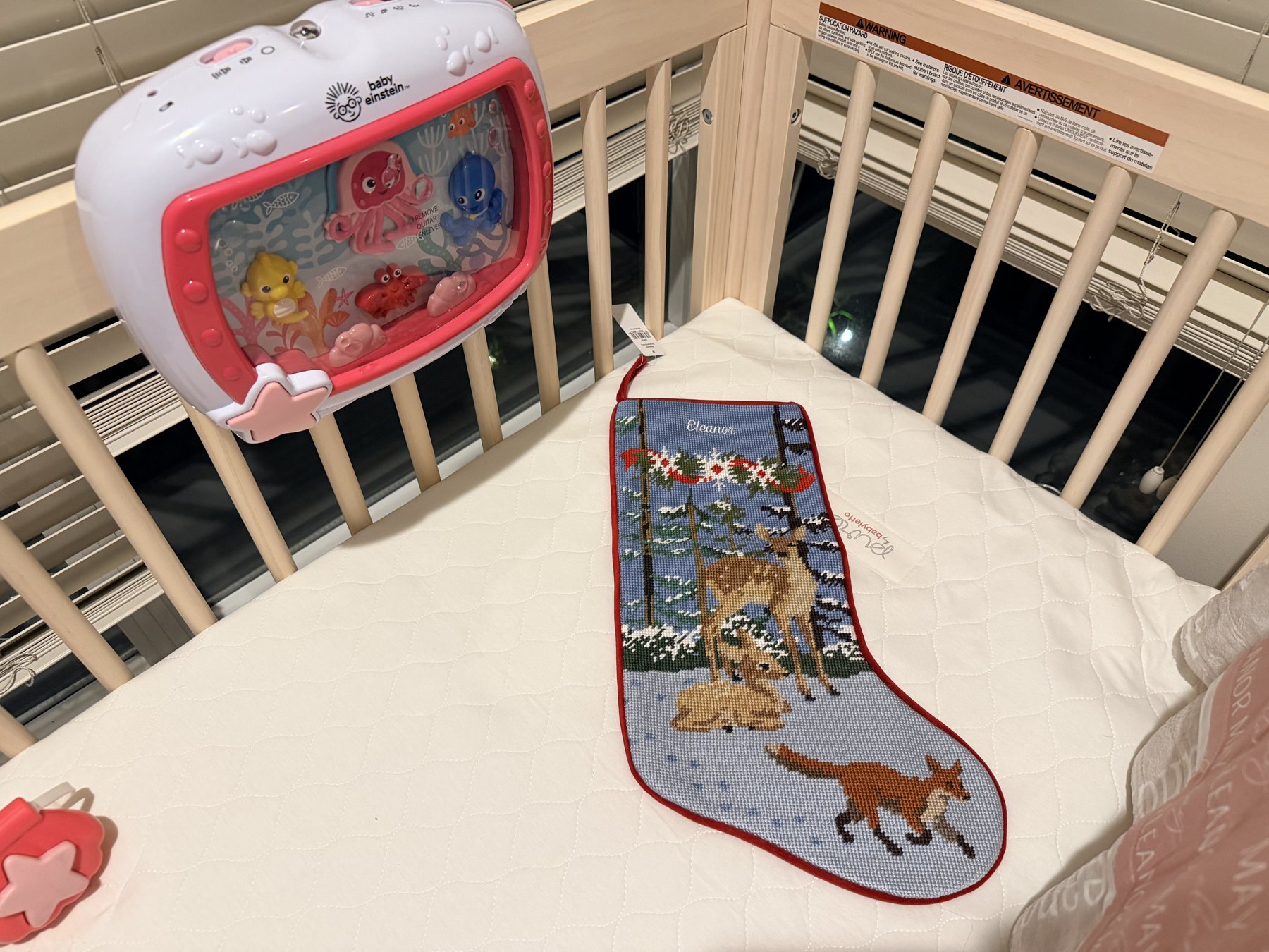 Personalized Eleanor Christmas stocking in the crib